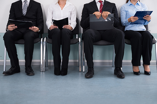 Businesspeople Sitting On Chair