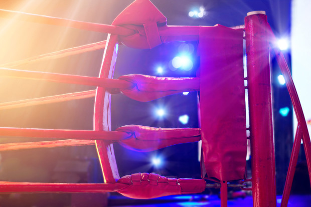 Boxing ring red corner and floodlights, dramatic lighting